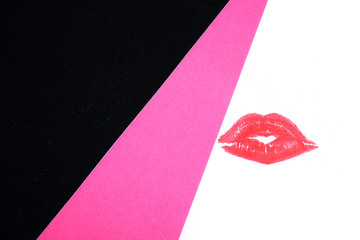 Designer advertising background. Lips on colored cardboard. Cosmetics.