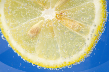 close-up of a lemon fruit, background in water, under water. background, texture