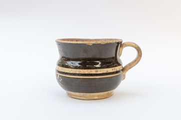 Antique majolica mug with stripes - isolated on white background