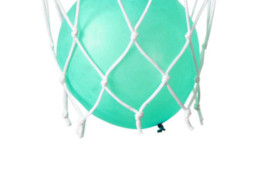 Blue balloon in a basketball net. Accurate throw in the ring. 