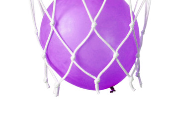 Blue balloon in a basketball net. Accurate throw in the ring. 