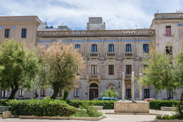 Fototapeta premium Building on Generale Scio Square in historic part of Trapani city, Sicily Island in Italy