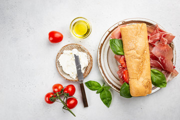 Spanish breakfast, top view. Toast or sandwich with jamon, cheese and tomato sauce