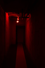 Empty corridor with red light