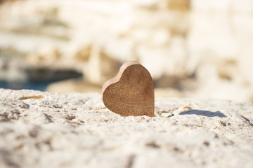 Wooden Heart On Rock. Love background