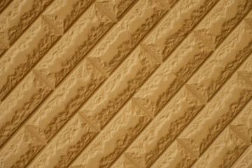 Diagonal view of yellowish orange brick wall