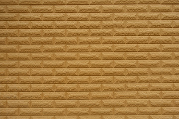 Texture of simple yellowish orange brick wall