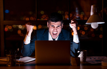 Angry Businessman Shouting Clenching Fists, Crumpling Paper Sitting In Office