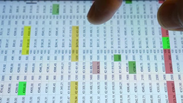 The hand (finger) work with phone touchscreen. Table, finance, currency. Close up macro view