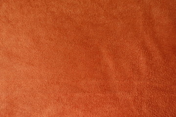 Bright orange artificial suede fabric from above