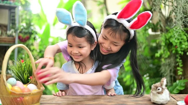 Happy Easter day. Kid with colorful eggs toy. Happy and fun for celebrate on April with family at home.