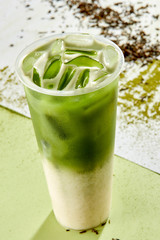 Cold drink with ice cubes and matcha