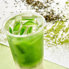 Cold drink with ice cubes and matcha