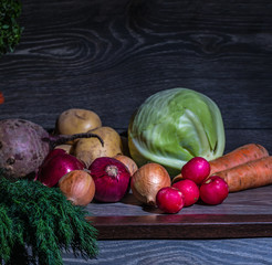 Different vegetables on a wooden table.