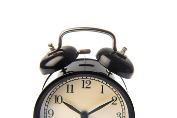 vintage black alarm clock isolated on white background