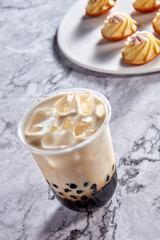 Bubble tea with small cakes