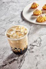 Bubble tea with small cakes
