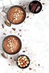 Chocolate smoothie with banana and nuts. Healthy eating. Top view with copy space.