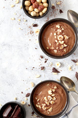 Chocolate smoothie with banana and nuts. Top view with copy space. Protein smoothie.