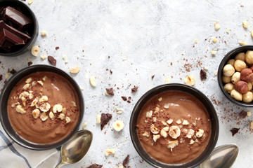 Chocolate smoothie with banana and nuts. Top view with copy space. Protein smoothie.