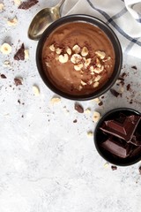Chocolate smoothie with banana and nuts. Healthy eating. Top view with copy space.
