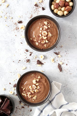 Chocolate smoothie with banana and nuts. Top view with copy space. Protein smoothie.