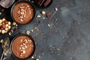 Chocolate smoothie with banana and nuts. Top view with copy space. Protein smoothie.