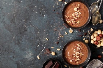 Chocolate smoothie with banana and nuts. Top view with copy space. Protein smoothie.