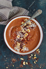 Chocolate smoothie with banana and nuts. Healthy eating. Top view with copy space.