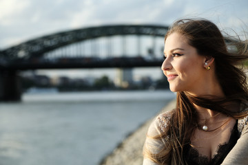 Beautiful stylish woman sitting on street stairs  on summer day