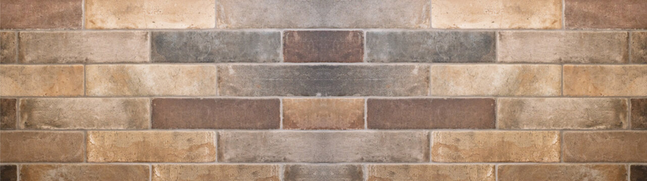 Brown gray natural stone tiles masonry wall texture background banner