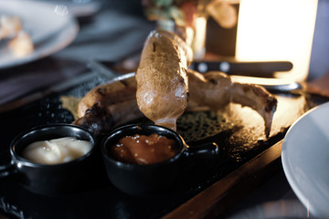 Fried sausages served with ketchup and mayonnaise