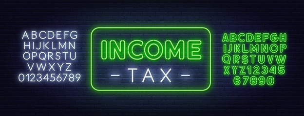 Income tax neon sign. Neon alphabet on brick wall background.