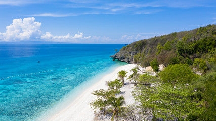 Aerial view of the Sumilon island, sandy beach with tourists swimming in beautiful clear sea water...
