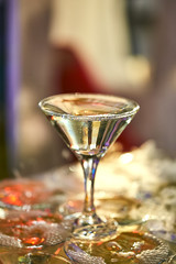 martini glasses in the form of a cascade or pyramid lit light at the wedding party