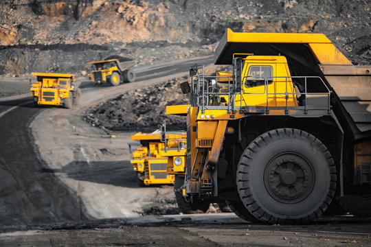 Open pit mine industry, big yellow mining truck for coal anthracite