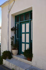 Fototapeta na wymiar Green door in Cypriot village. Vintage style Cypriot village. 