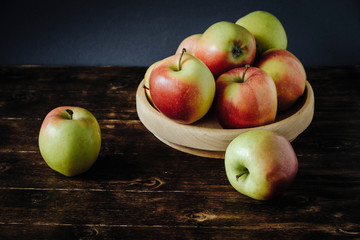 Fresh apples on a dark marble table