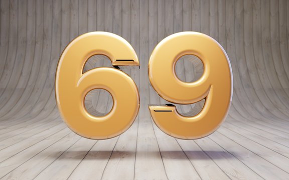 Golden Number 69 On Wooden Floor.