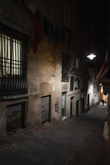 Fototapeta premium Vertical night street view of old Genova