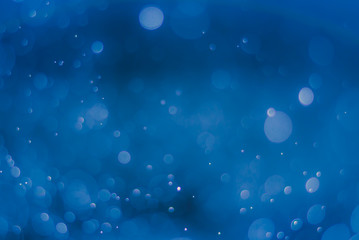 abstract sparkle bokeh light effect  with dark blue background, abstract bokeh background