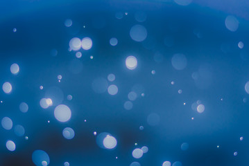 abstract sparkle bokeh light effect  with dark blue background, abstract bokeh background