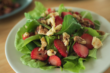 salad with strawberry spinach leaves and feta cheese