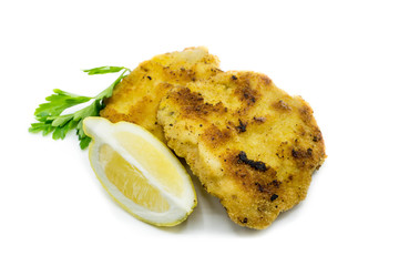 breaded schnitzel with lemon isolated on white background
