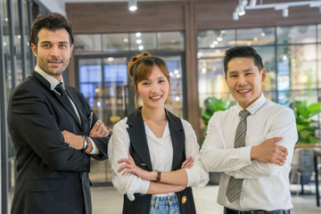 Group of employees with boss Standing with arms crossed with confidence show the best teamwork...