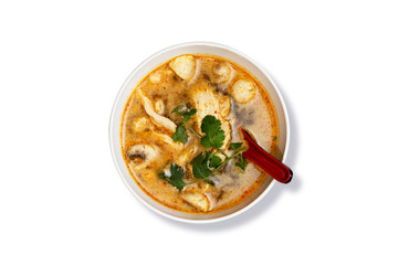 Top View of Tom Yum Chicken Soup, Thai Spicy Soup with Mushroom, Cilantro and Chicken Breast Isolated on White Background. Asian Food. Clipping Path on the Main Object (not the shadow) Included