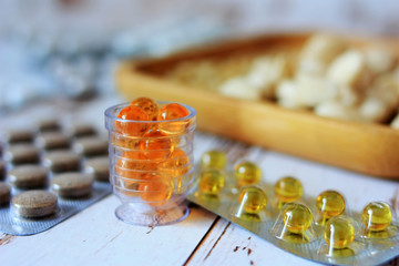 Pills and vitamins on a plate