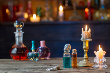 magic potions in bottles on wooden table