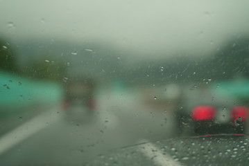 Blurred image running on highway on rainy day
