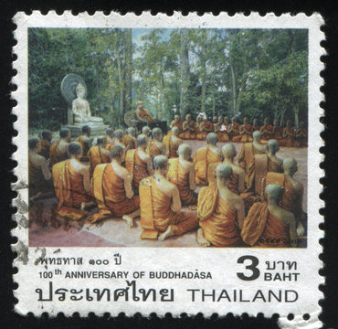 praying near Buddha statue